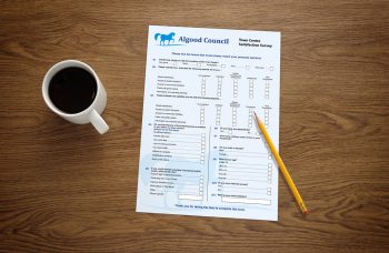 Paper survey on table with pencil and mug of coffee